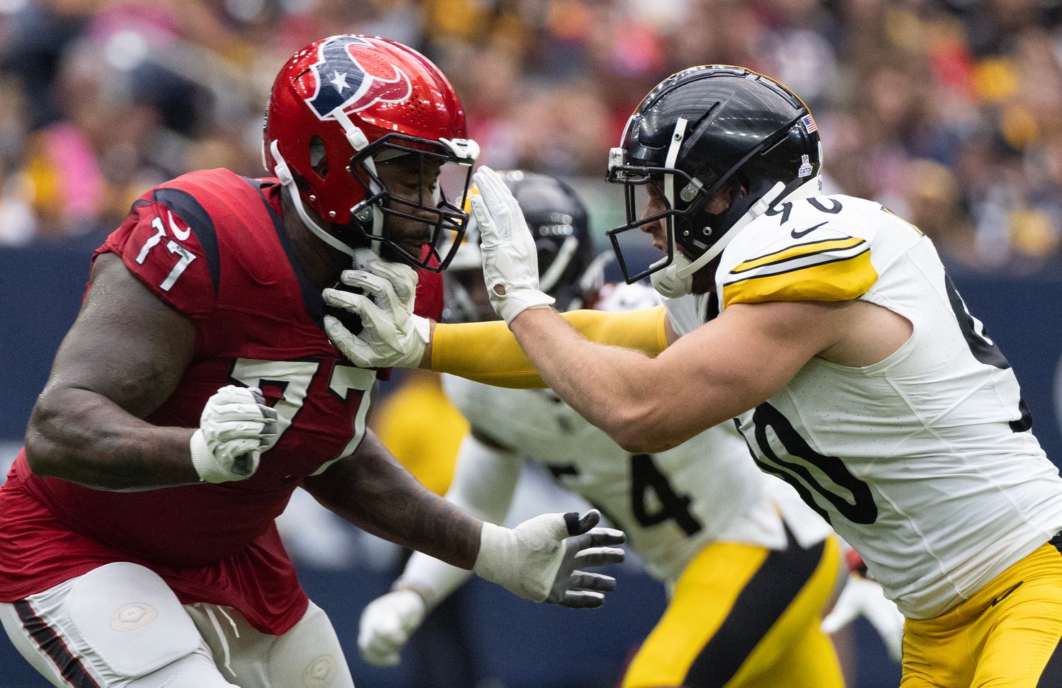 Texans offensive tackle George Fant blocks Pittsburgh Steelers linebacker T.J. Watt